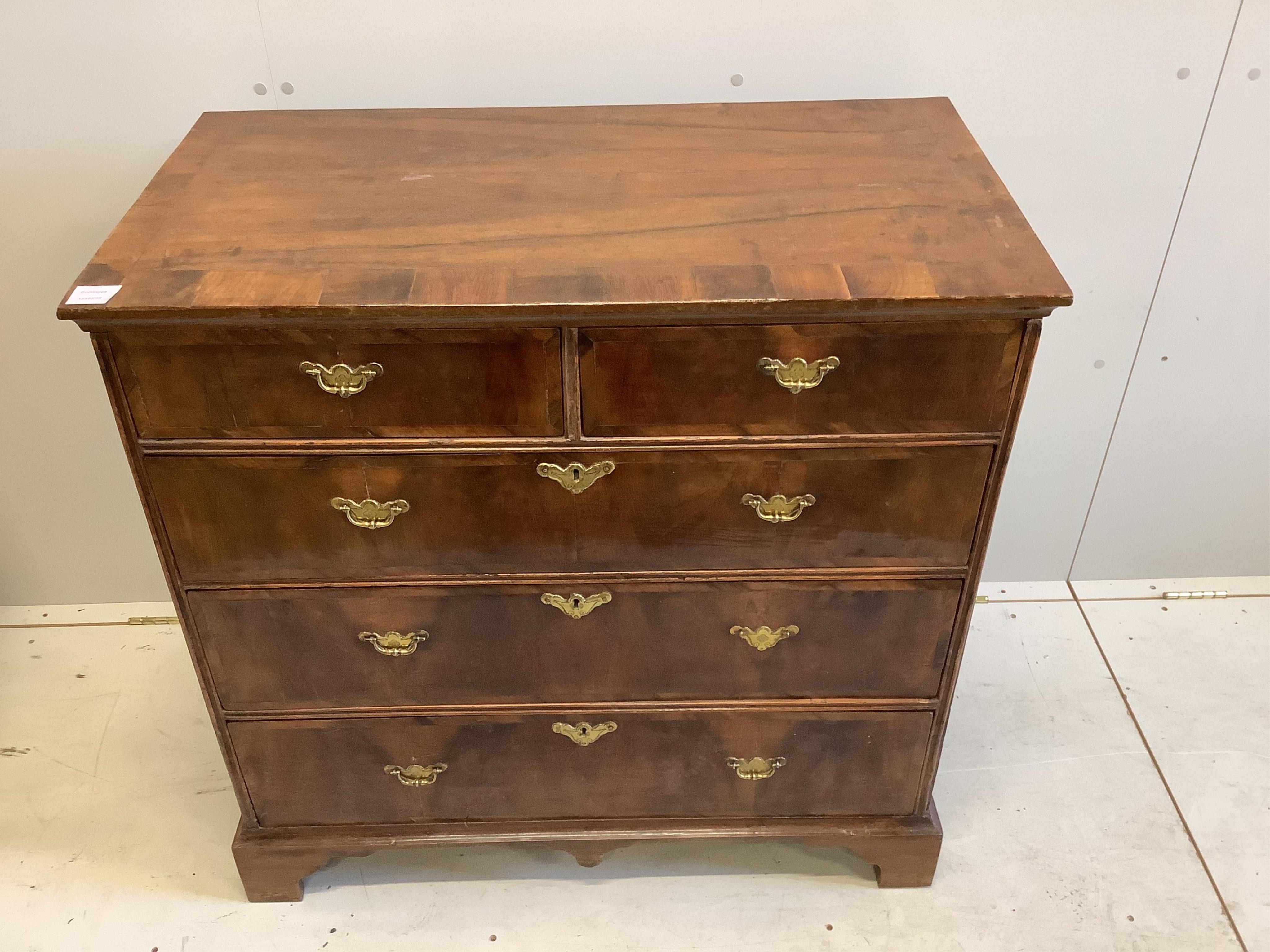 An early 18th century banded walnut chest, fitted two short and three long drawers, width 90cm, depth 49cm, height 89cm. Condition - good